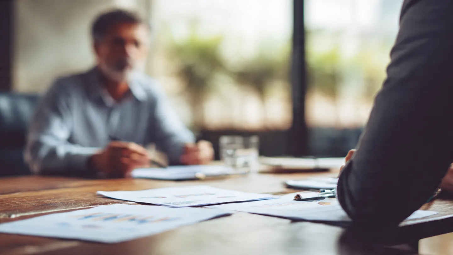 Business meeting using accurate bookkeeping data for strategic decision-making.