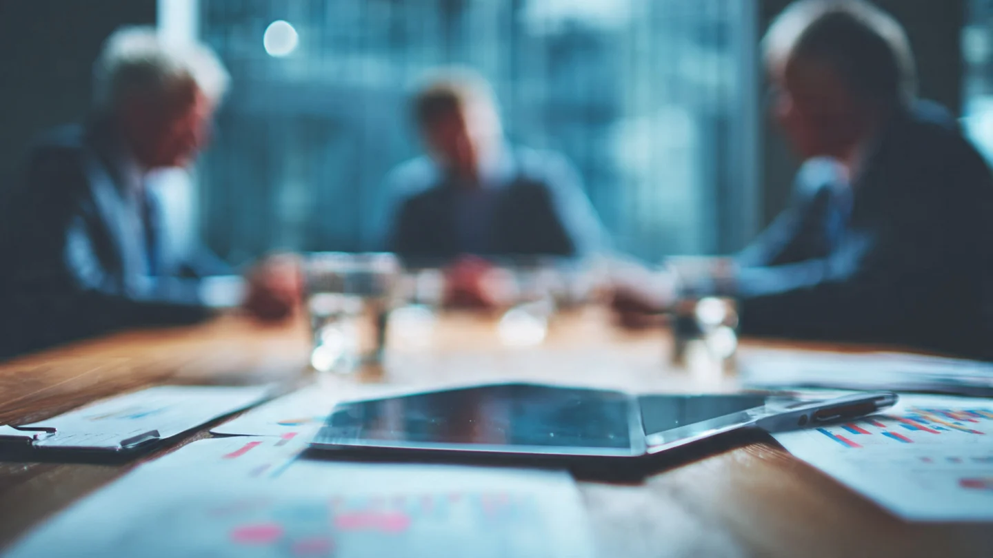 Executive analyzing financial statements for strategic business growth.