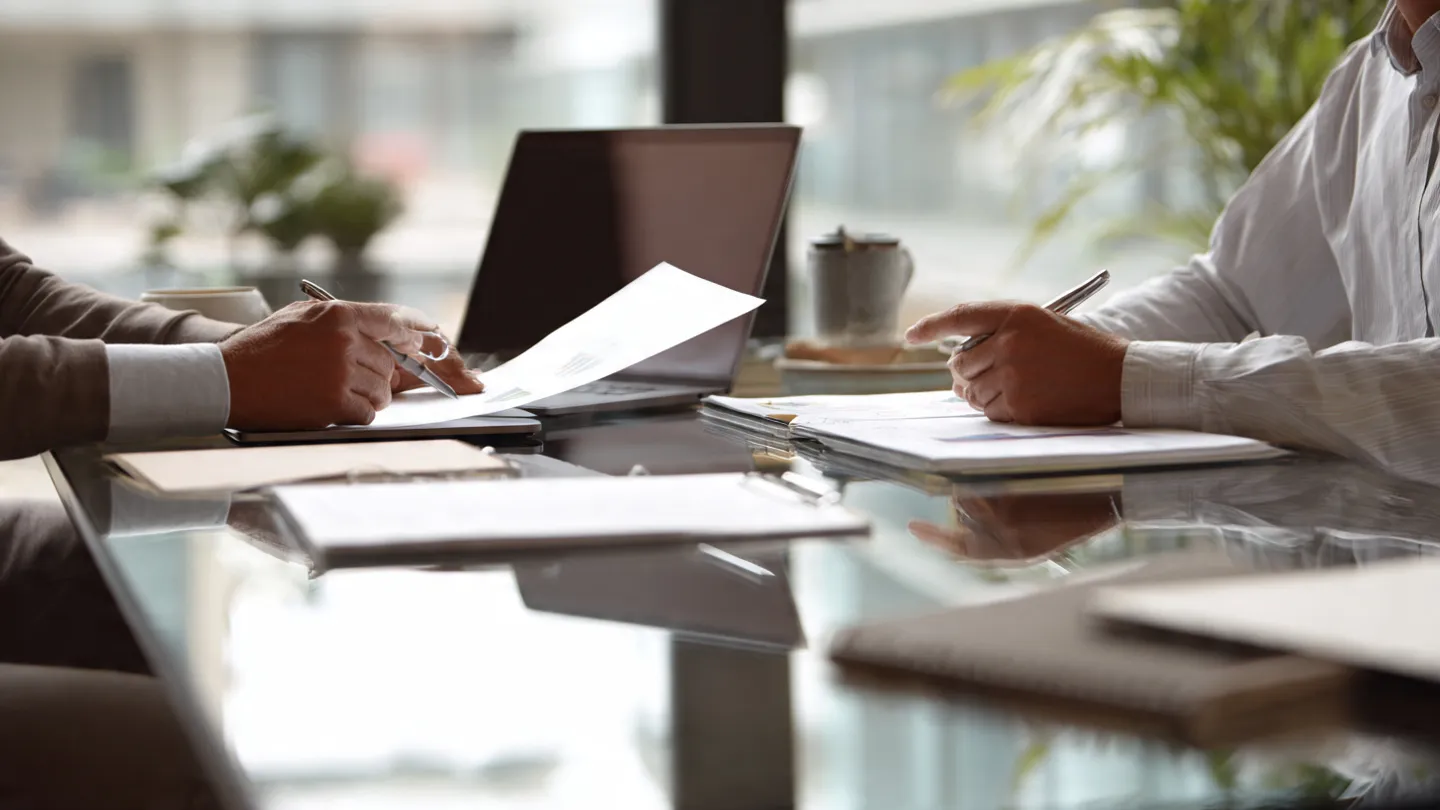 Business partners reviewing financial strategy with an outsourced CFO.