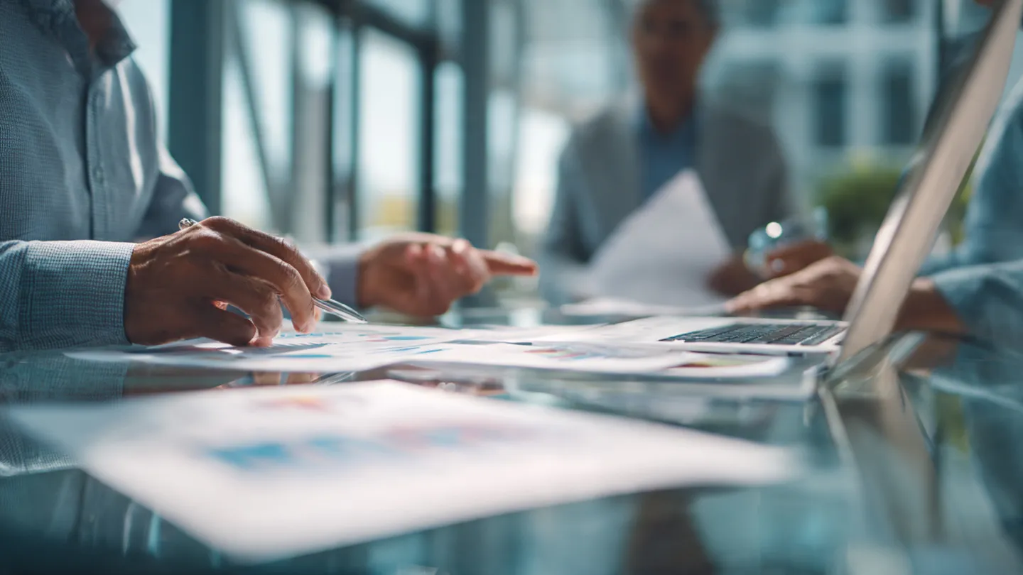 Financial reports and a calculator on a desk, highlighting data needs when hiring a CFO early.